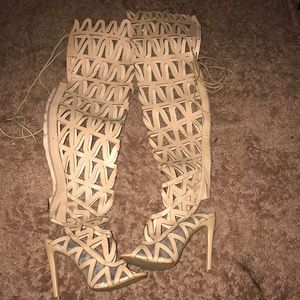 Mid thigh heel boots.